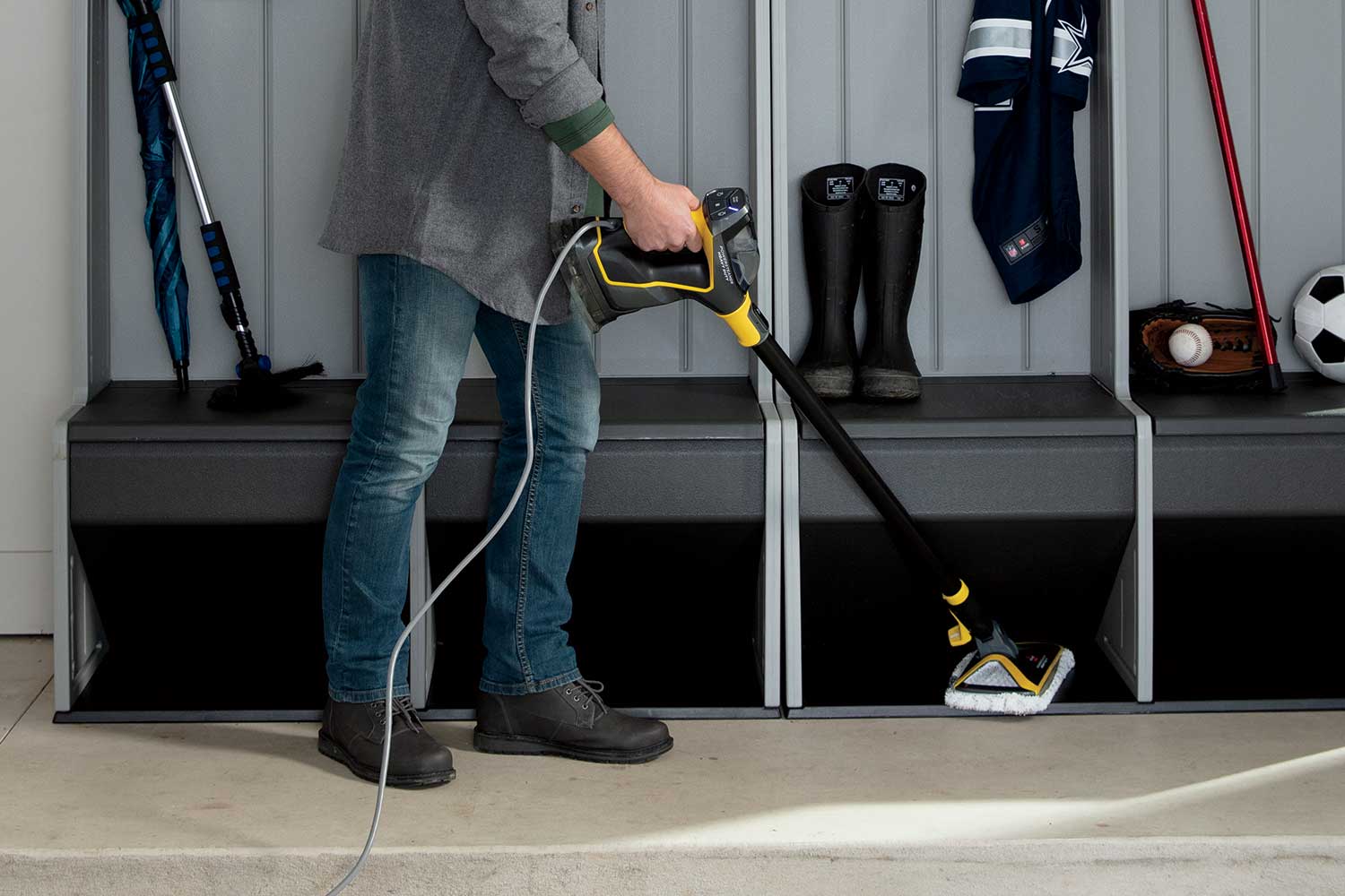 BISSELL PowerSteamer Heavy Duty 2685A shown being used with its cloth-pad floor head